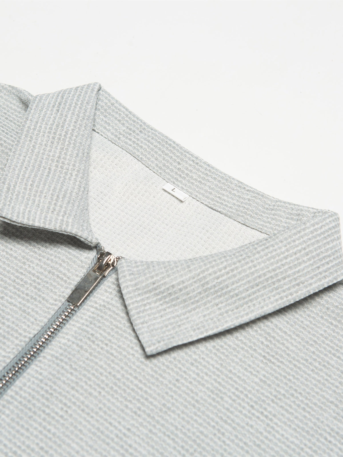 Polo zippé manches courtes maille texturée