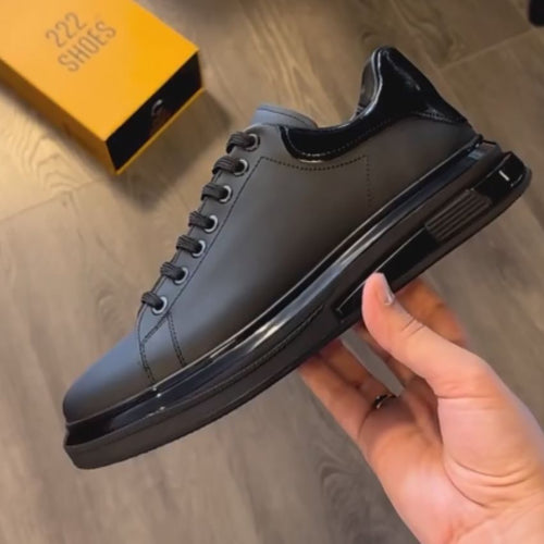 Baskets basses noires effet cuir lisse