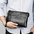 Pochette en cuir à dragonne au chic discret homme – La Tour-d'Aigues