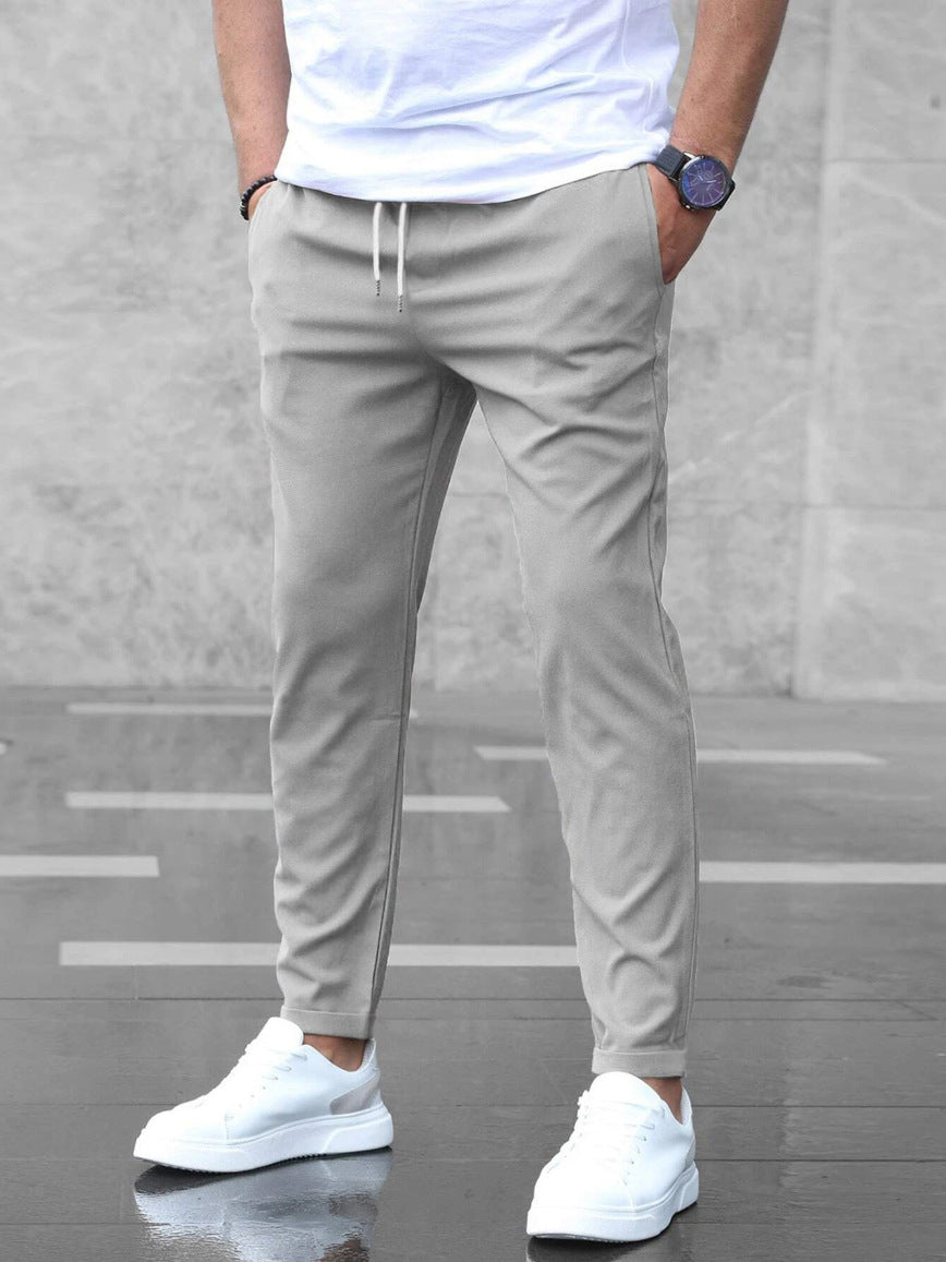 Pantalon taille élastique à cordon coupe fuselée gris homme, vue de face
