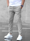 Pantalon taille élastique à cordon coupe fuselée gris homme, vue de face
