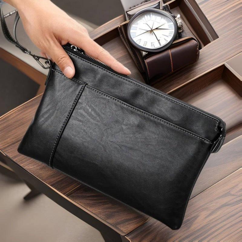 Pochette en cuir à dragonne au chic discret homme – La Tour-d'Aigues