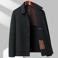 Veste courte aspect lainage noire à col chemise et boutons pression