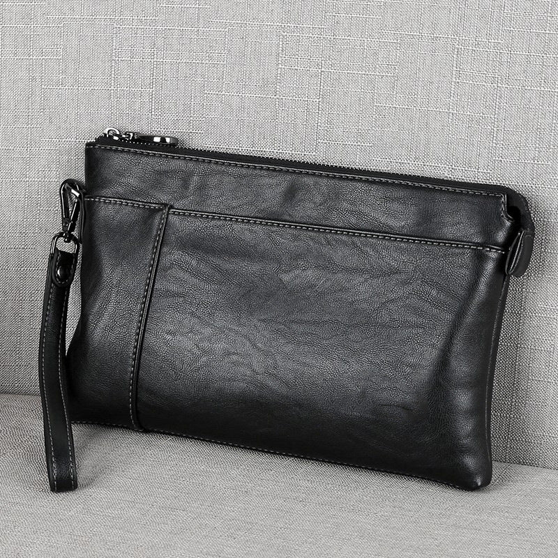 Pochette en cuir à dragonne au chic discret homme – La Tour-d'Aigues