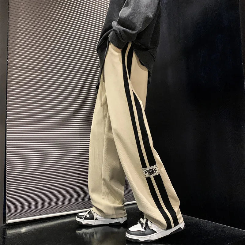 Pantalon large côtelé noir à bande latérale