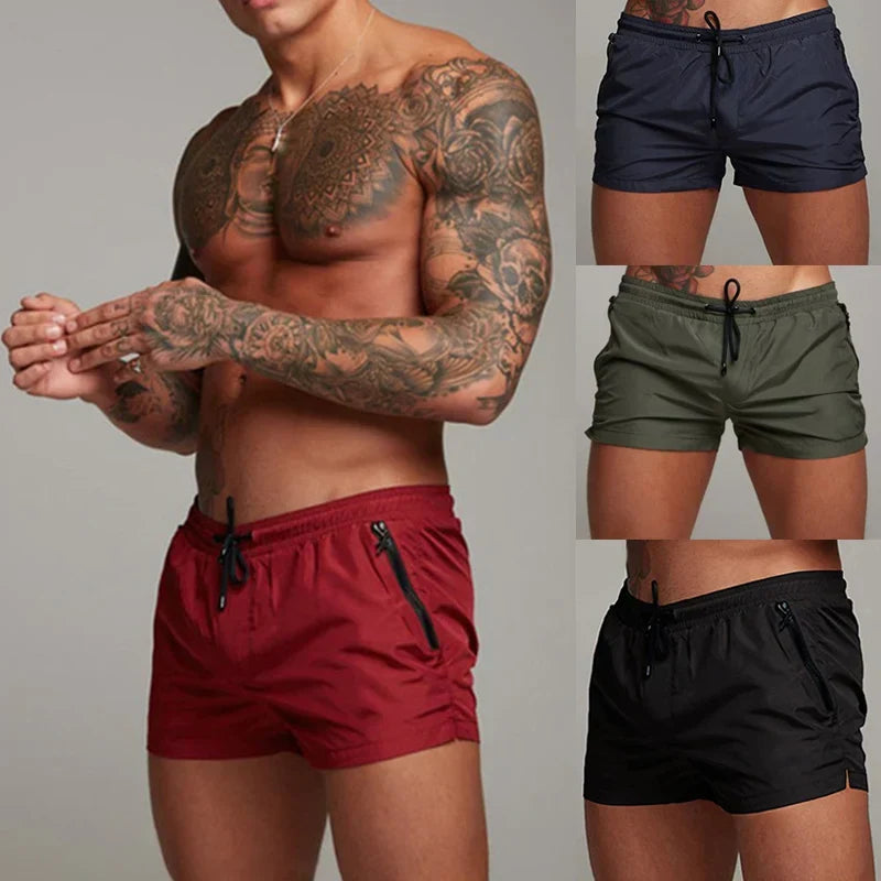 Short de bain homme Denfert présenté en rouge, bleu marine, vert et noir