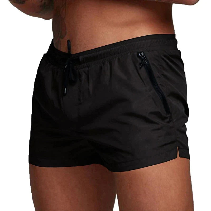 Short de bain noir homme, taille à cordon et poches zippées
