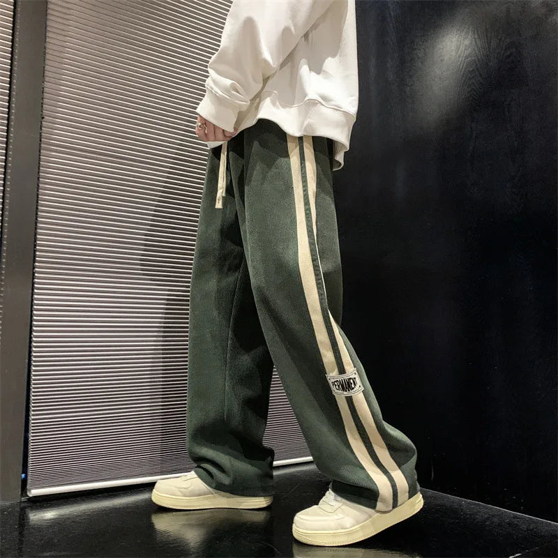 Pantalon large côtelé noir à bande latérale