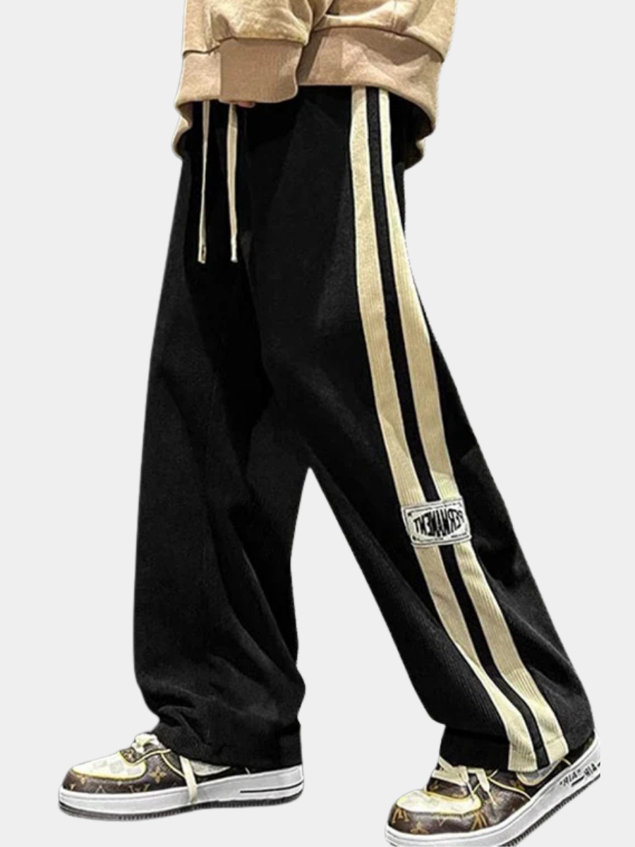 Pantalon large côtelé noir à bande latérale