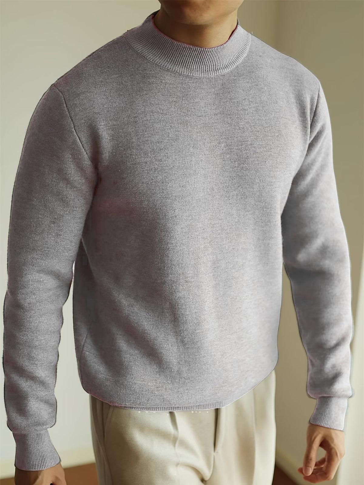 Pull col roulé en maille côtelée